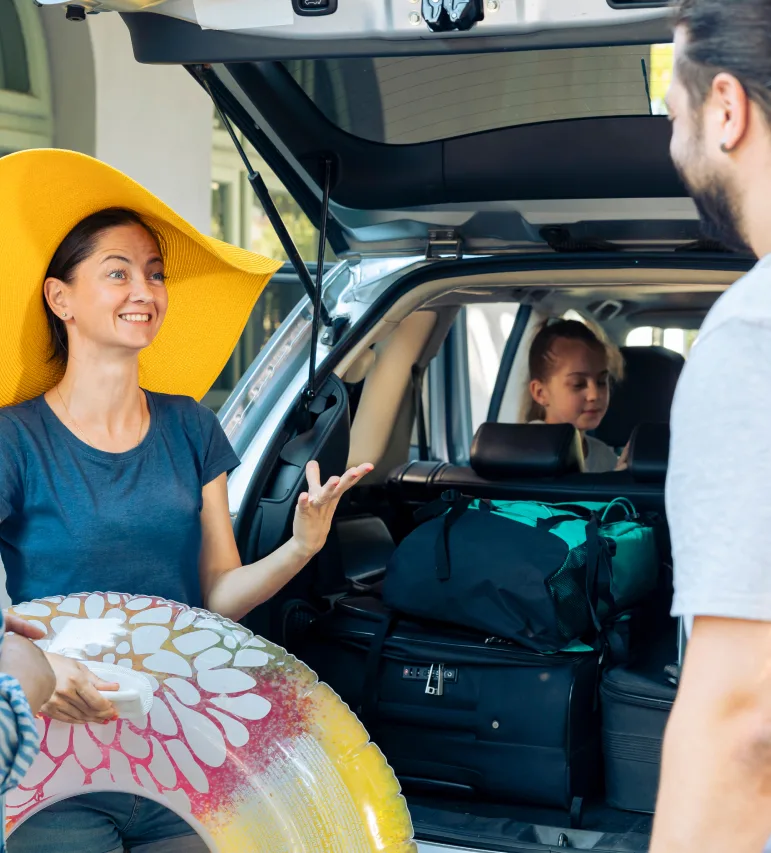 a family taking round trip in a car